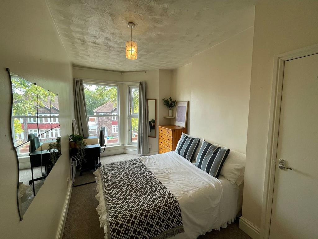 Bright and inviting double bedroom featuring a ...