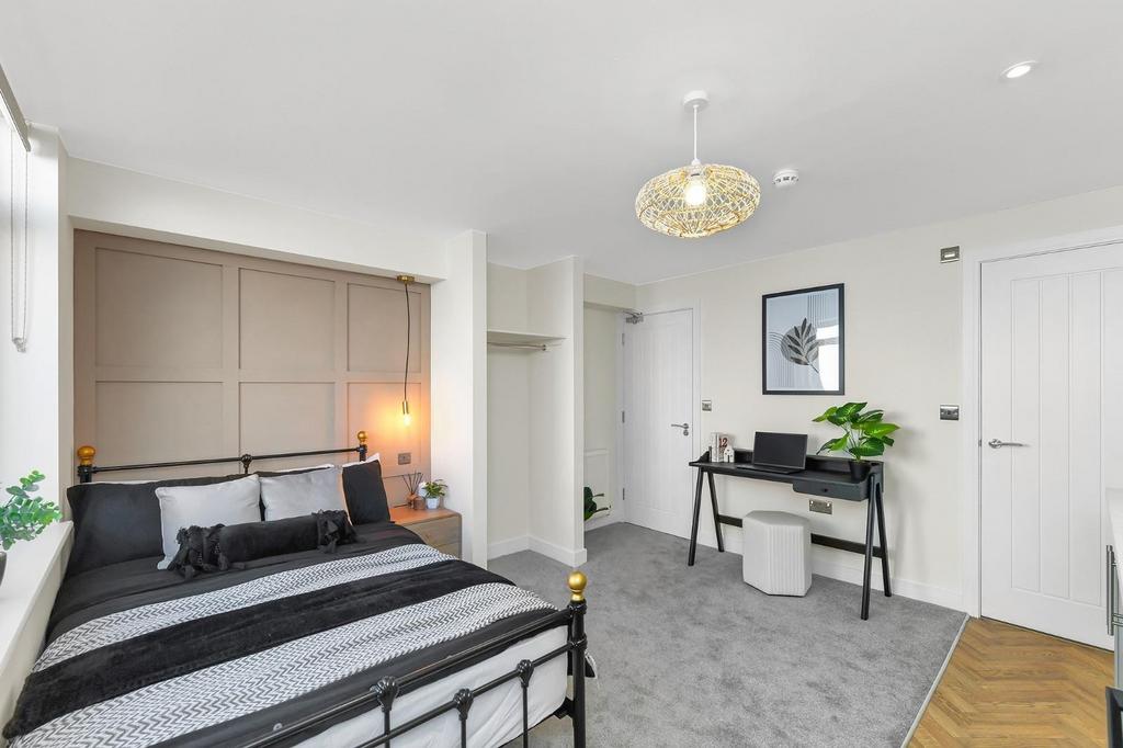 A stylish double bedroom featuring a comfortabl...