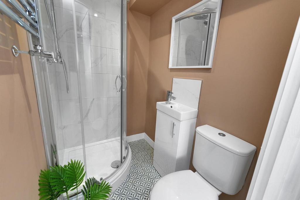 This modern bathroom features a sleek design wi...