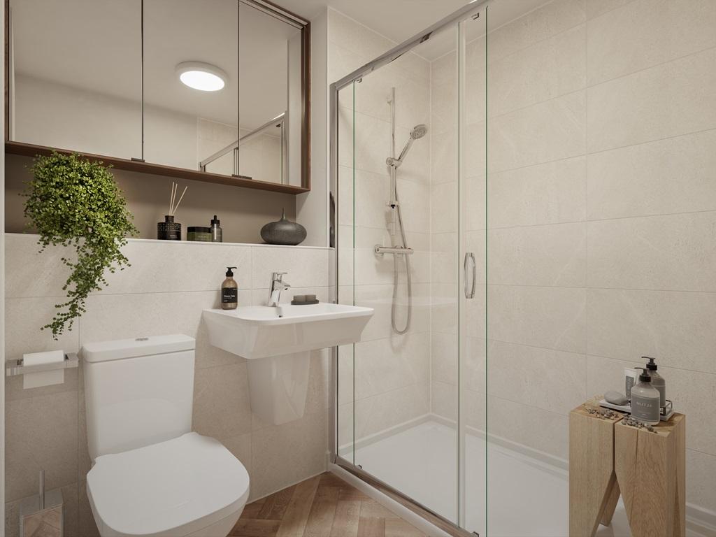 A stylish en suite shower room offers both...