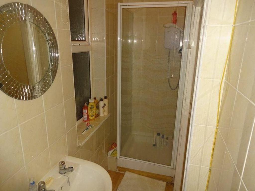 A well-maintained bathroom featuring a modern s...