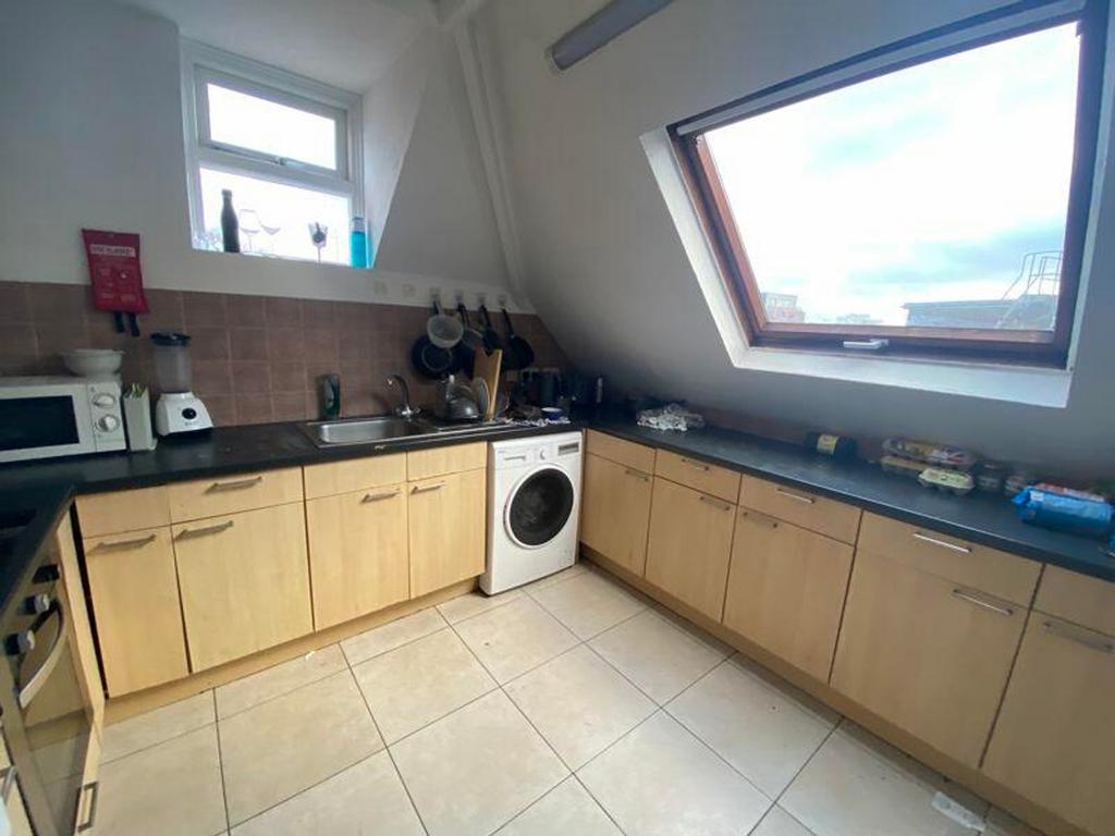 A bright and functional kitchenette with modern...