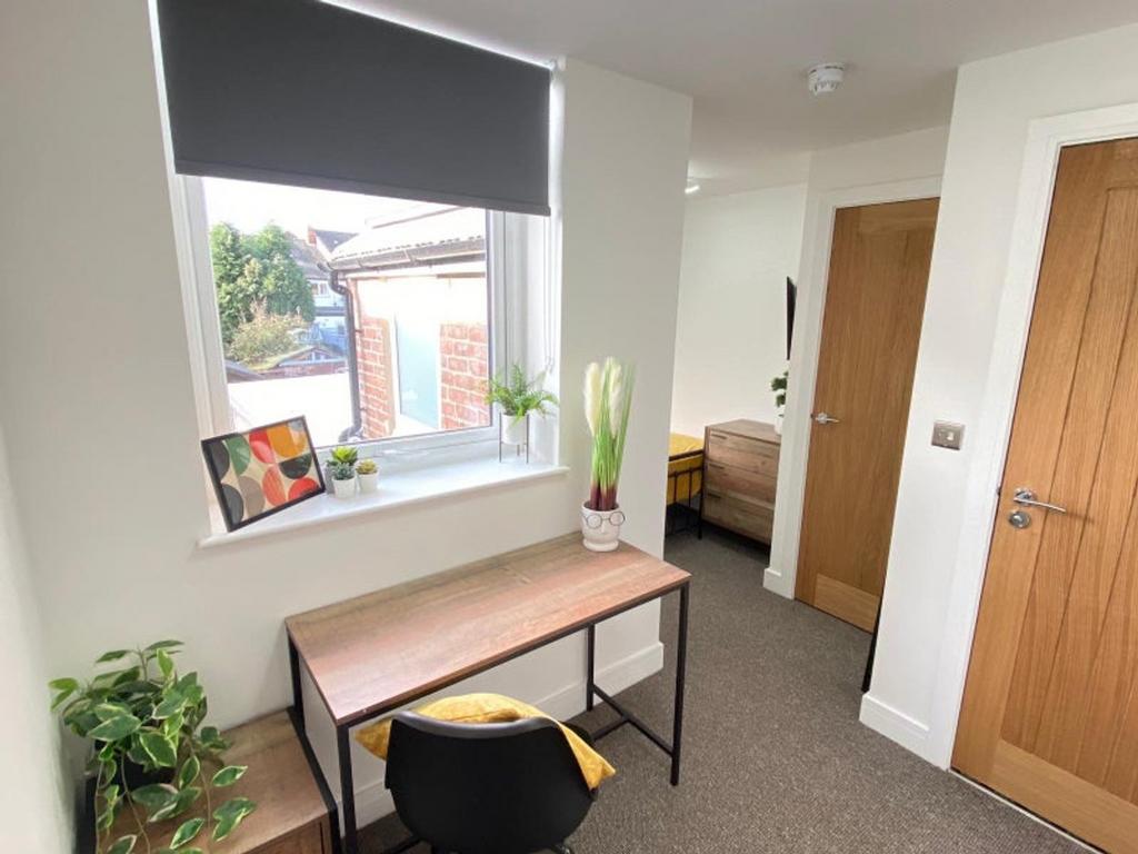 A bright and inviting communal workspace featur...