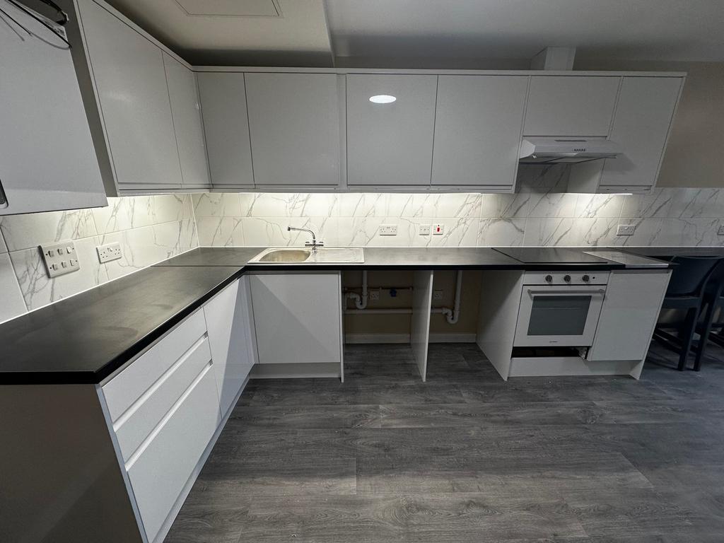 Modern kitchen with sleek cabinetry and ample c...