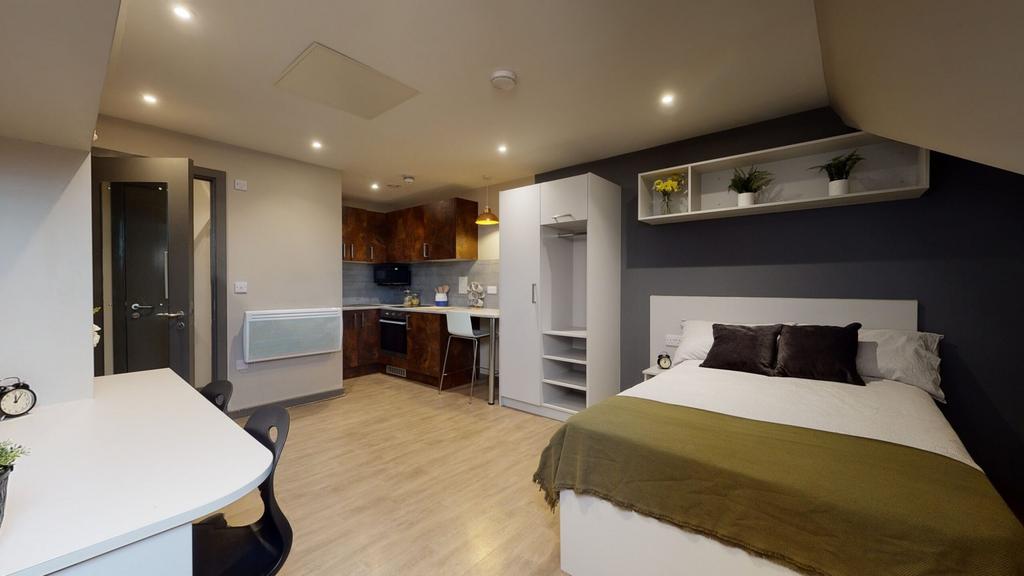 A spacious and modern double bedroom with ample...