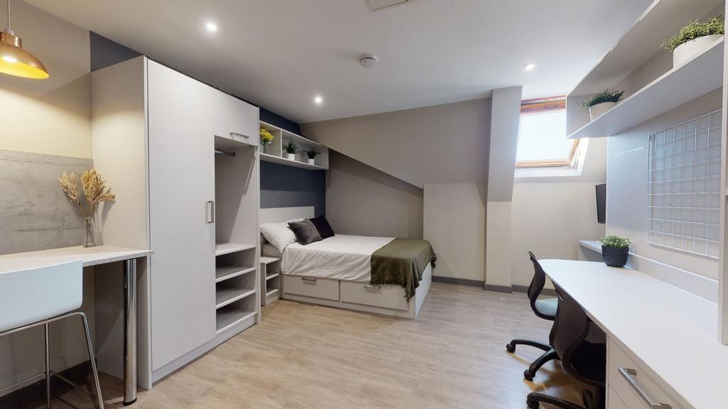A spacious and stylish double bedroom designed ...