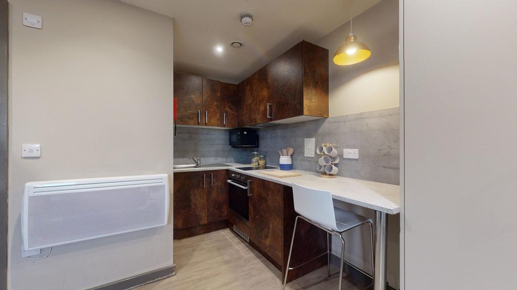 A modern and tidy kitchenette with stylish fini...