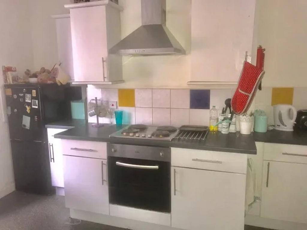 A functional and tidy kitchenette with modern a...