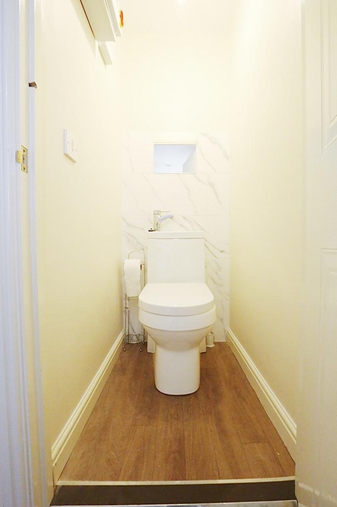 Bright and neatly finished WC with contemporary...