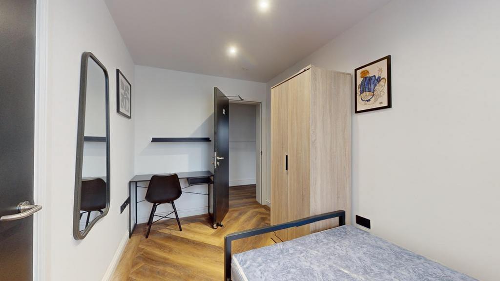 A modern and inviting double bedroom featuring ...