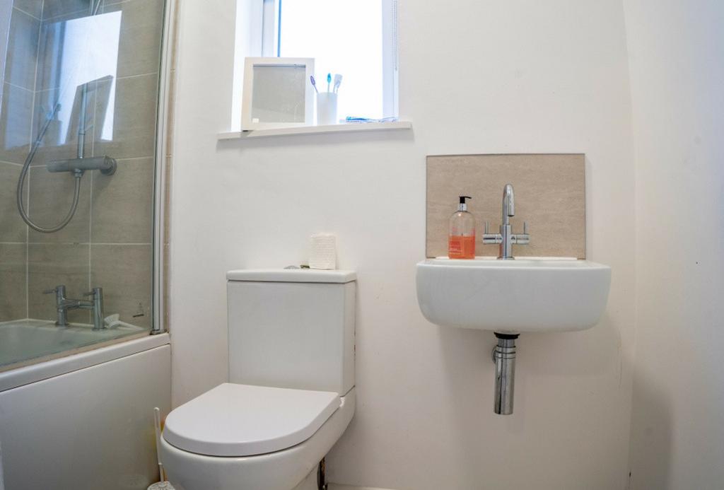 A clean and modern bathroom featuring a stylish...
