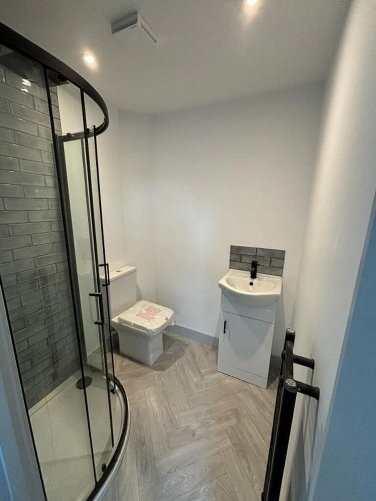 This modern bathroom features a sleek design wi...