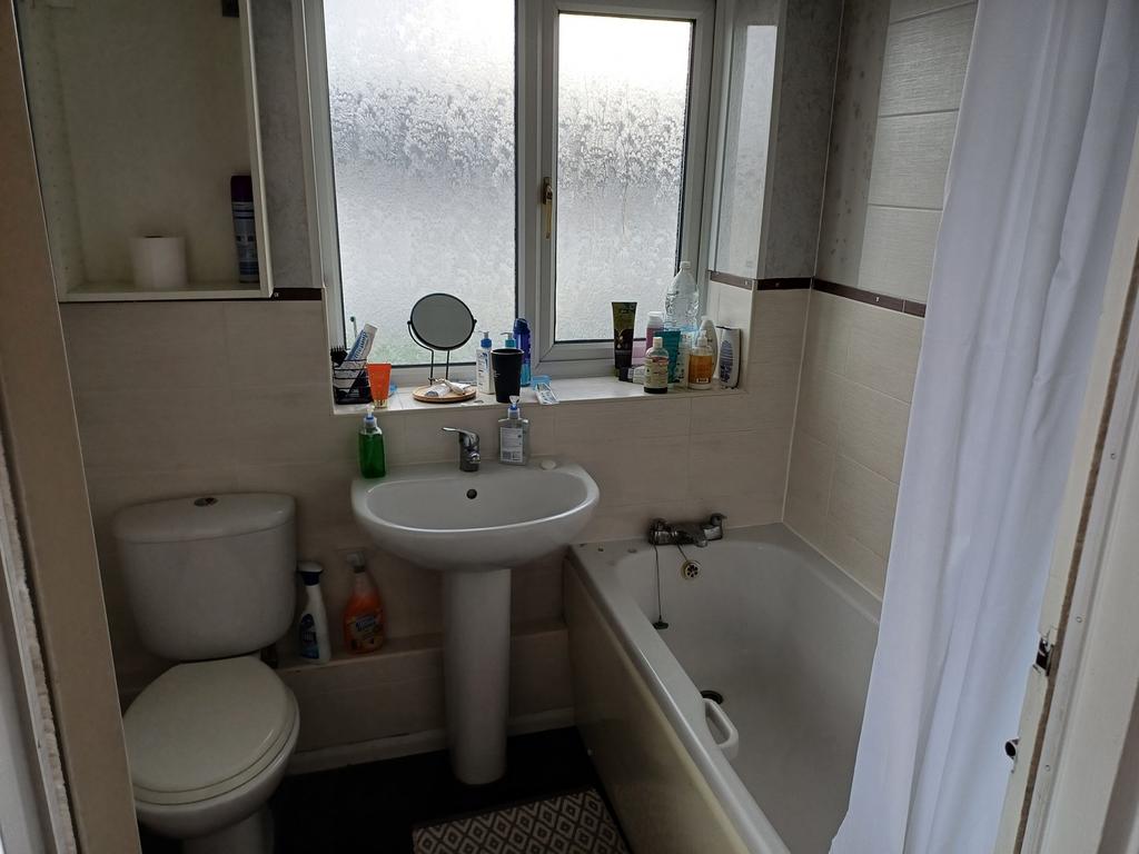A well-maintained bathroom featuring a relaxing...