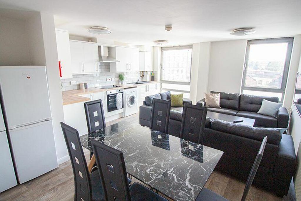 Spacious and modern living area featuring a com...