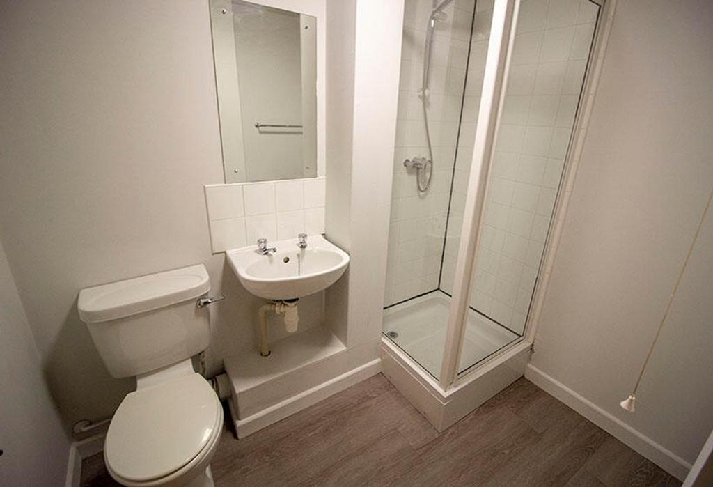 Bright and modern bathroom featuring a sleek sh...