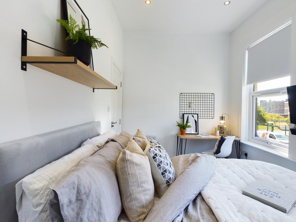 A spacious and inviting large double bedroom fi...