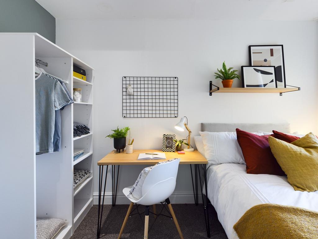 A bright and inviting double bedroom with moder...