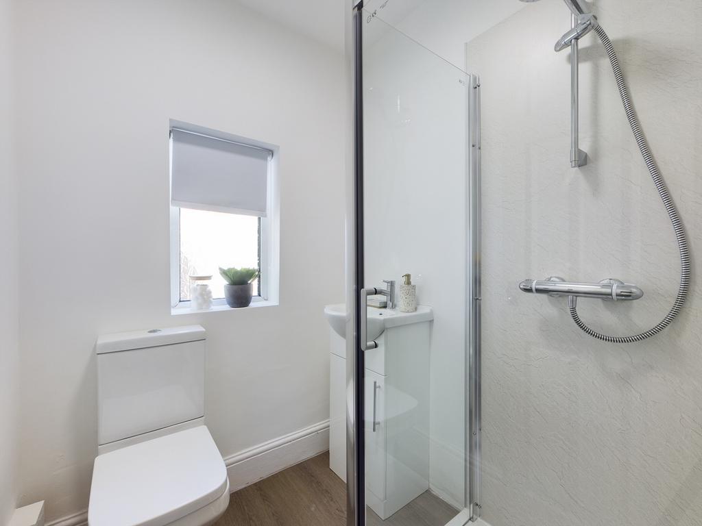 A modern and clean bathroom featuring a refresh...