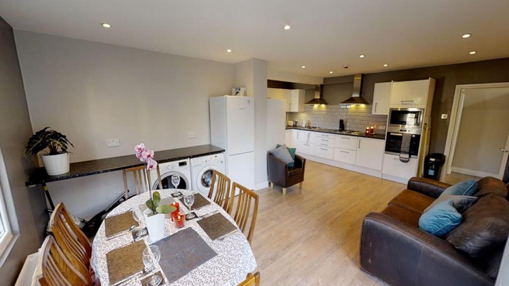 A modern kitchen featuring sleek cabinets, ampl...