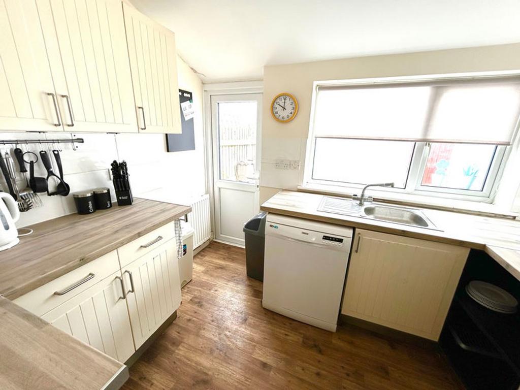 Bright and inviting kitchen featuring modern ap...
