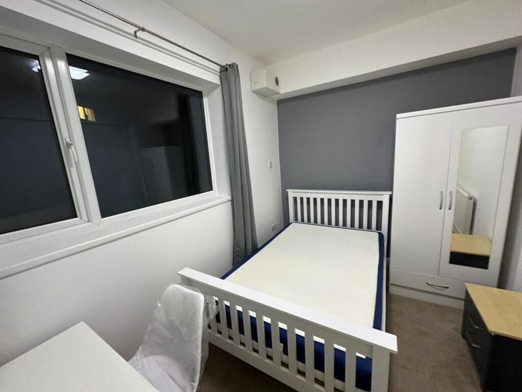 Bright and inviting double bedroom featuring a ...