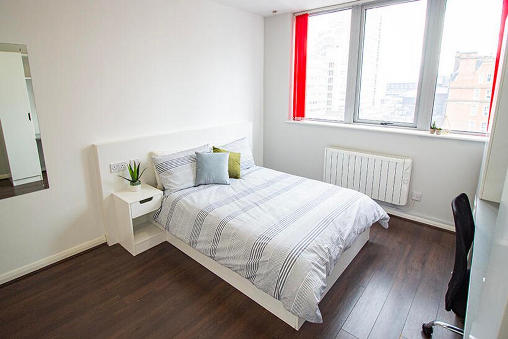 Bright and inviting double bedroom featuring a ...