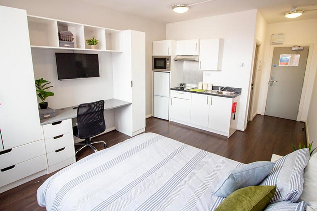 This inviting double bedroom features a comfort...