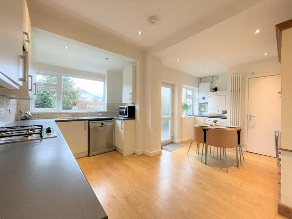 A bright and spacious kitchen featuring modern ...