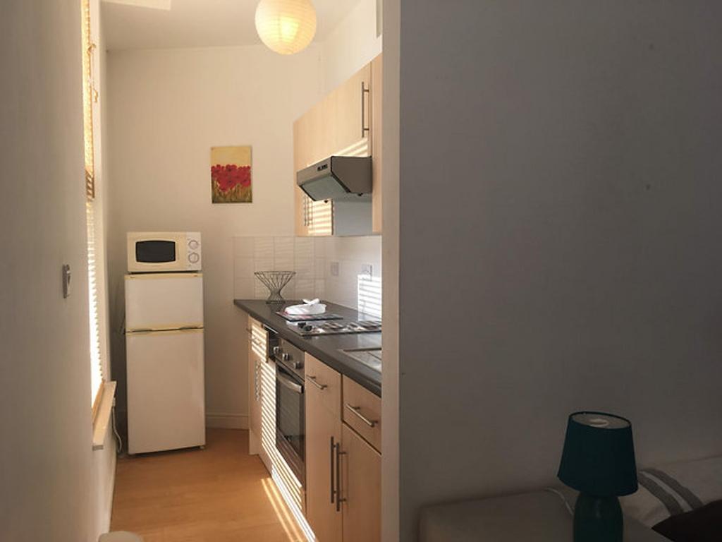 A cozy kitchen area featuring modern appliances...