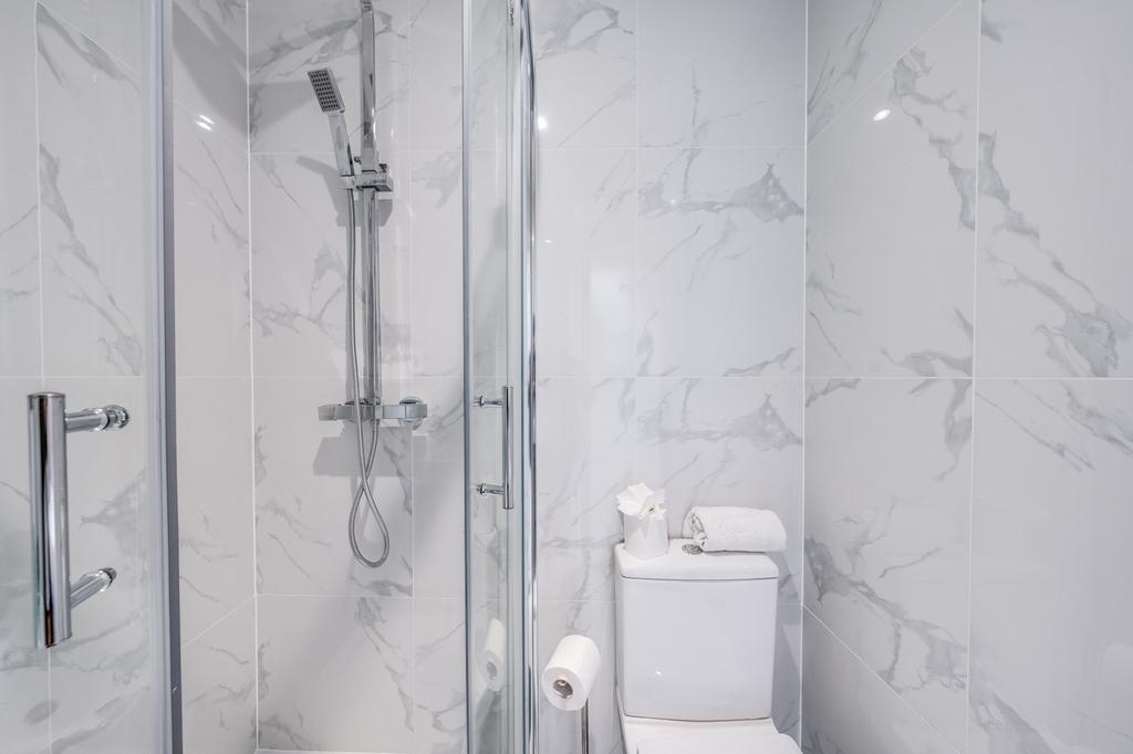 A modern and stylish bathroom featuring sleek m...