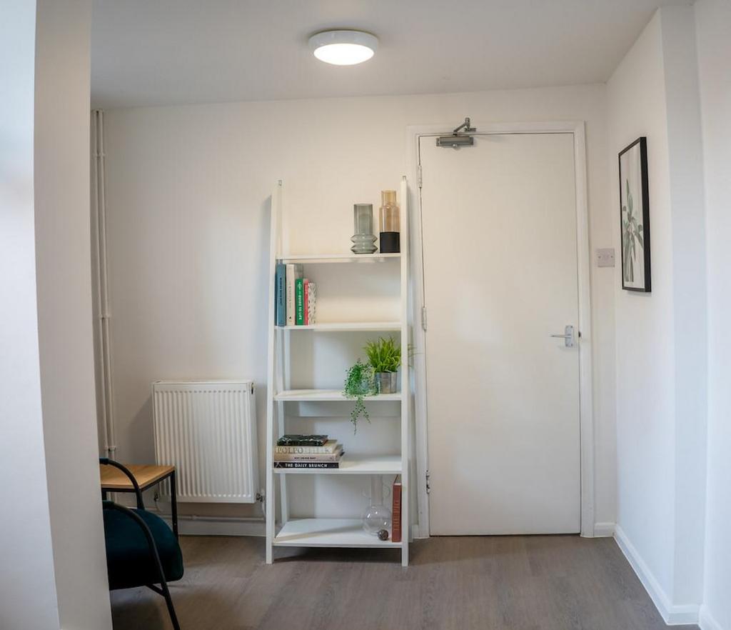 A bright and tidy hallway with modern decor and...