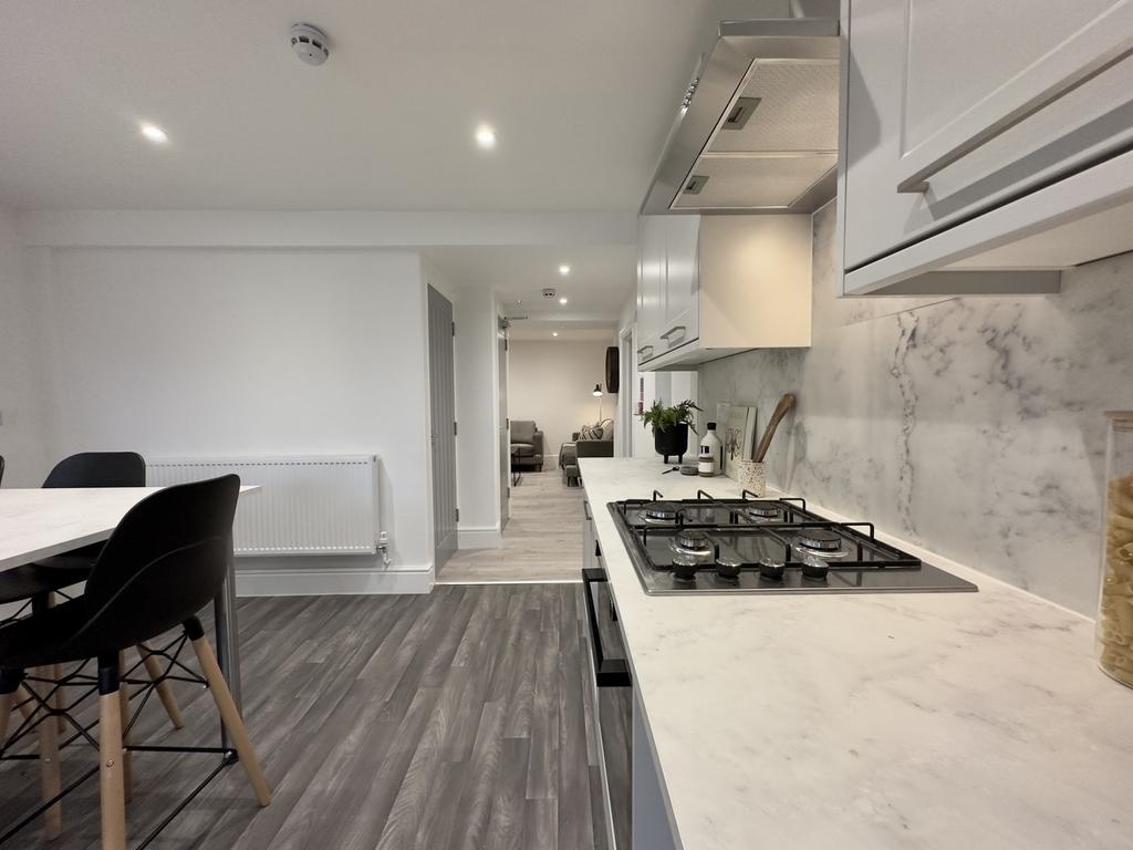 A modern and clean kitchenette featuring stylis...