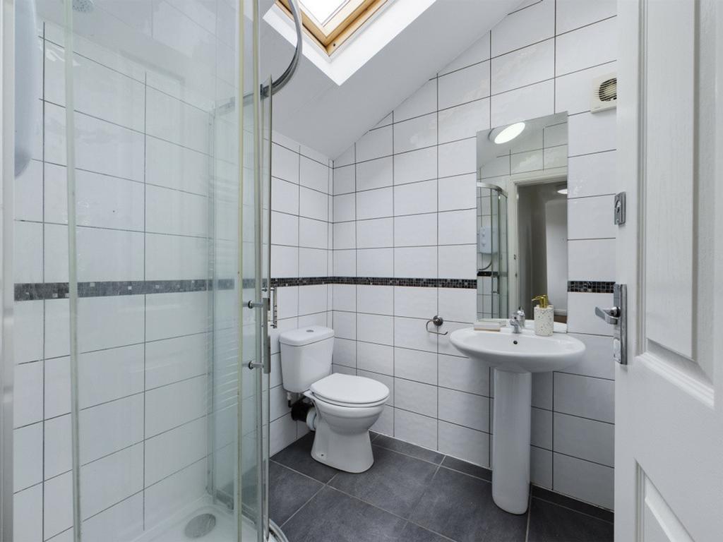 A bright and modern bathroom featuring a spacio...