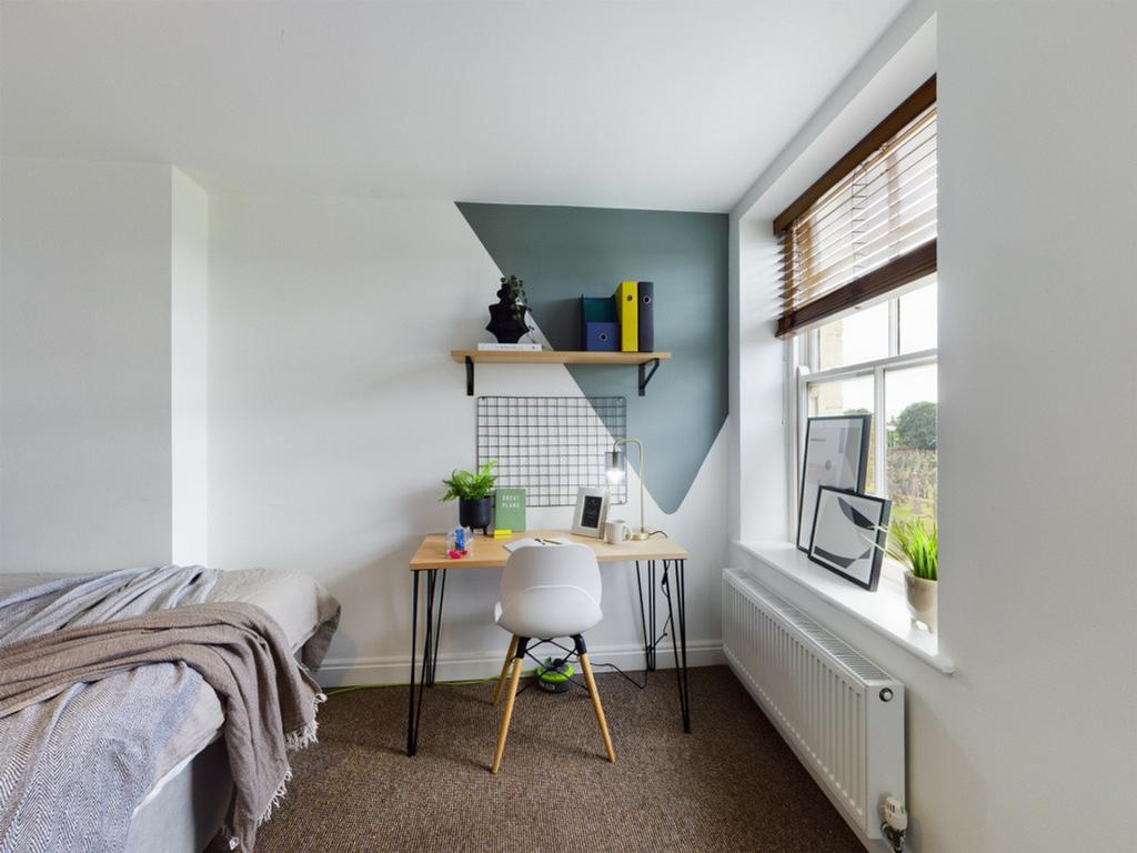 A stylish and clean double bedroom featuring a ...