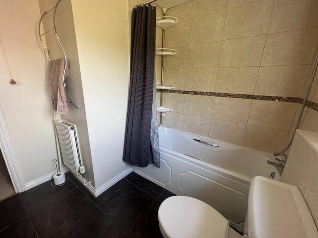 A well-maintained bathroom featuring a relaxing...