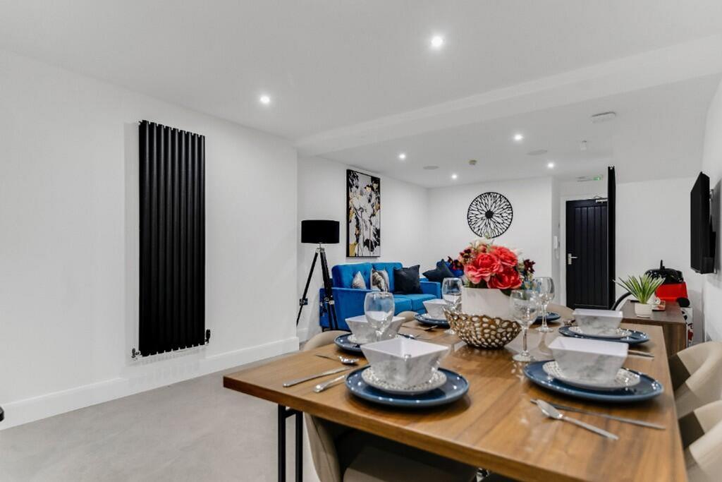A stylish and spacious living room designed for...