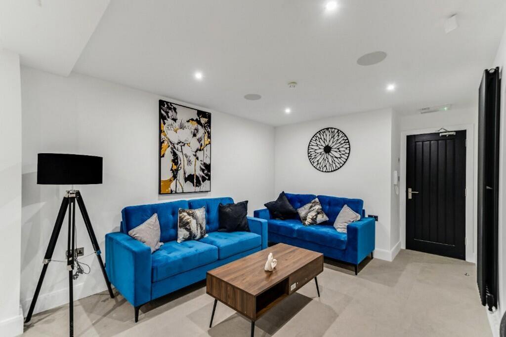 This contemporary living room features stylish ...