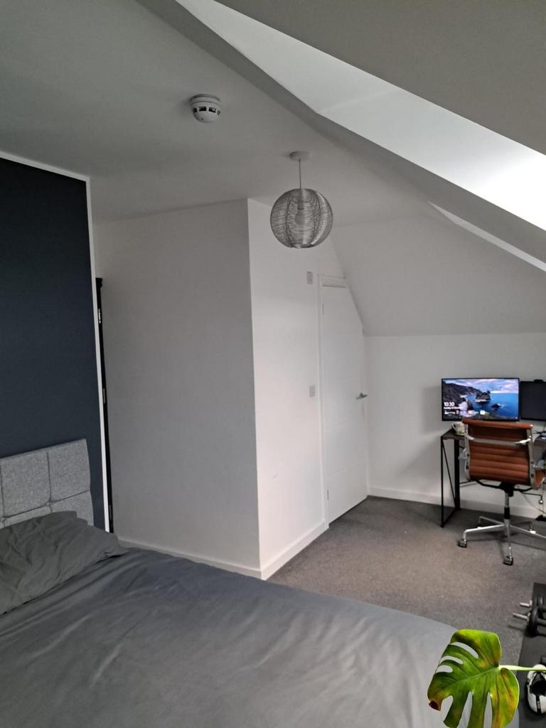 Experience a cozy double bedroom featuring a st...