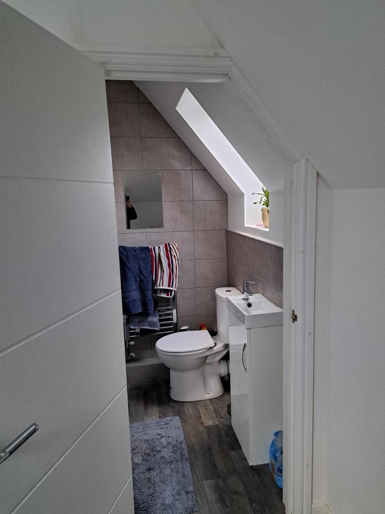 A modern bathroom featuring stylish fixtures, a...