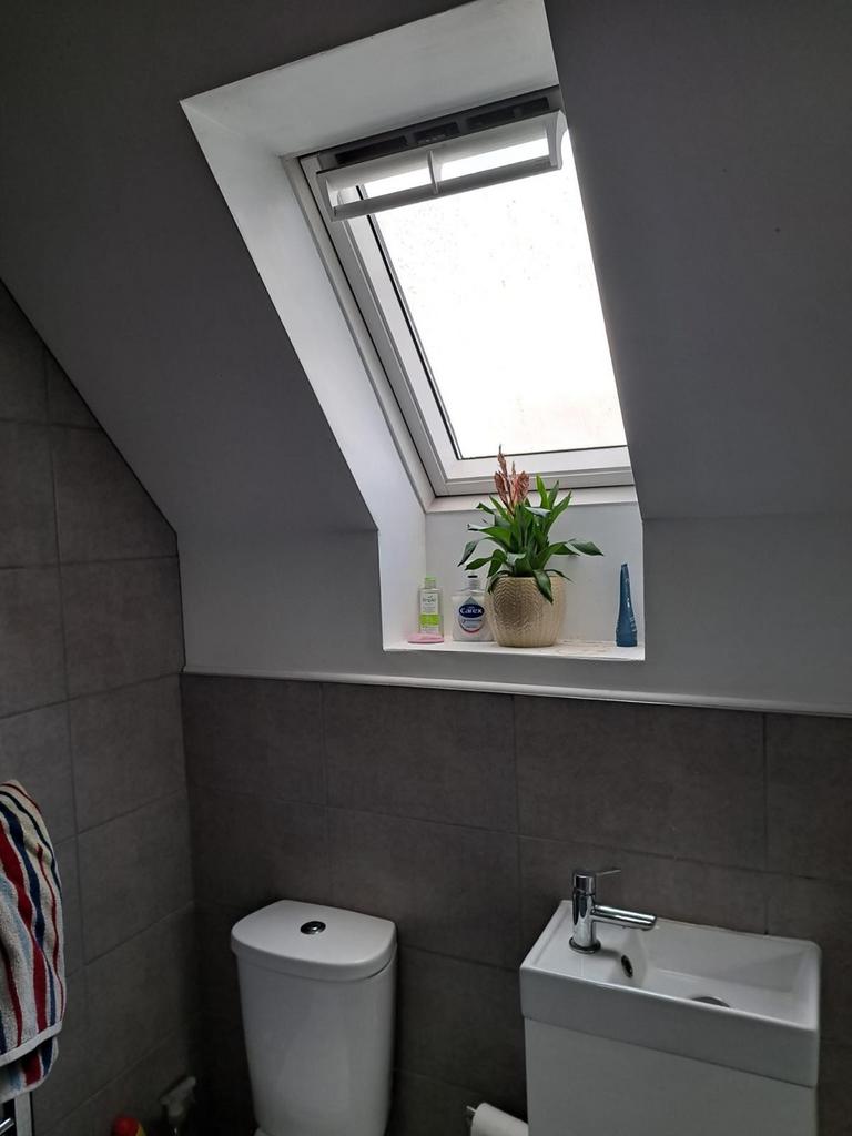 This modern bathroom features a stylish design ...