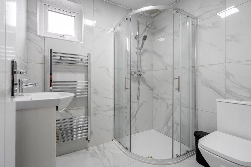 This modern bathroom features a sleek design wi...