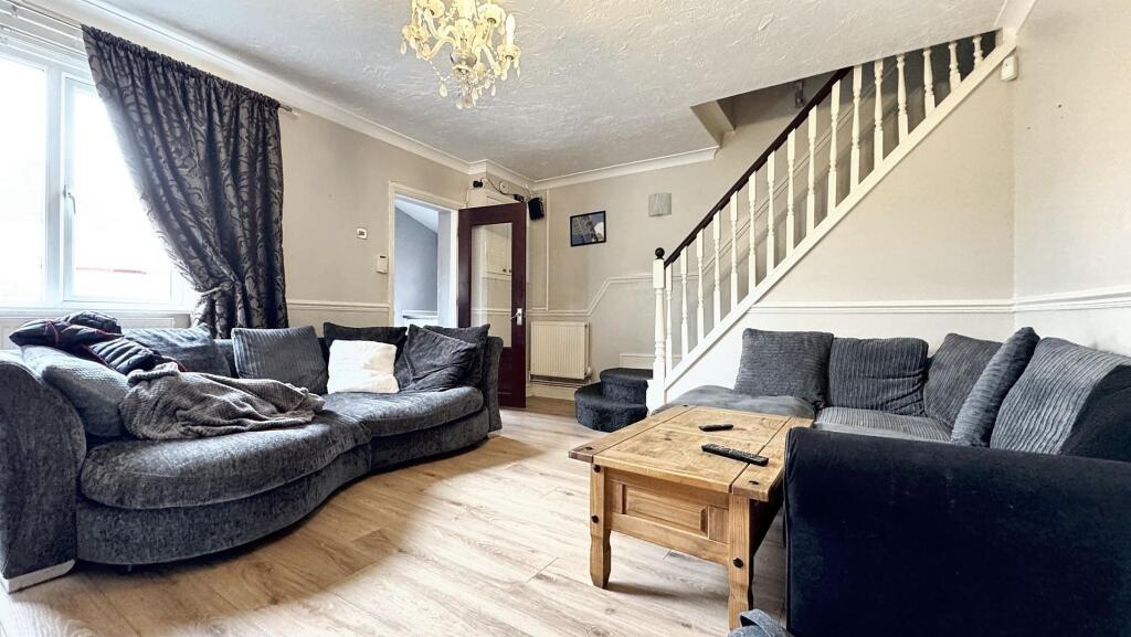 A cozy living room featuring a spacious section...