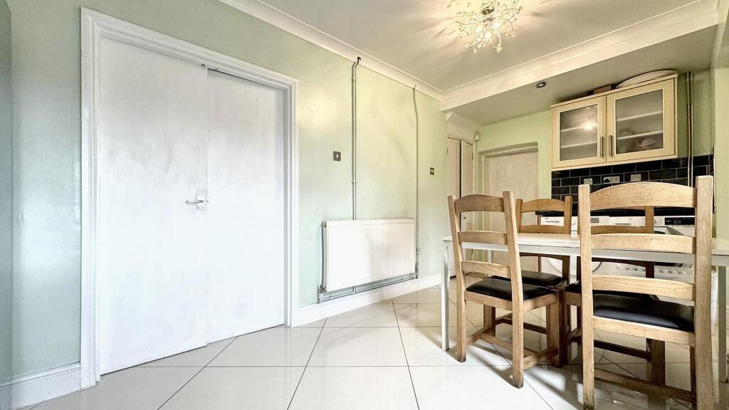 Bright and spacious kitchen area featuring a co...