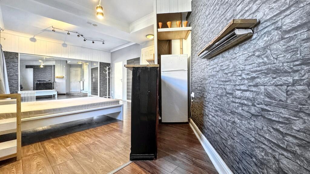 Bright and inviting kitchen space featuring mod...
