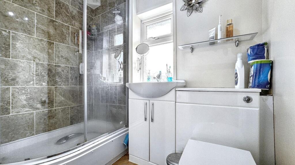 A modern bathroom featuring a sleek design with...