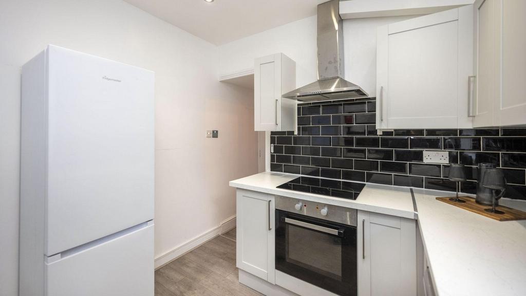 A modern and clean kitchenette featuring sleek ...