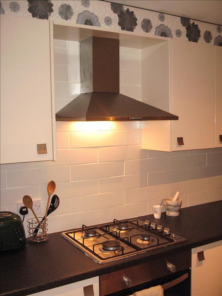 A modern kitchen featuring a sleek design with ...