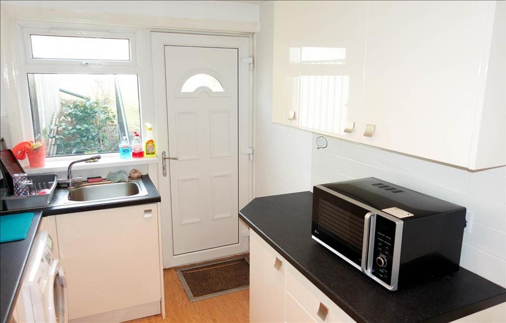 This modern kitchen features a functional layou...