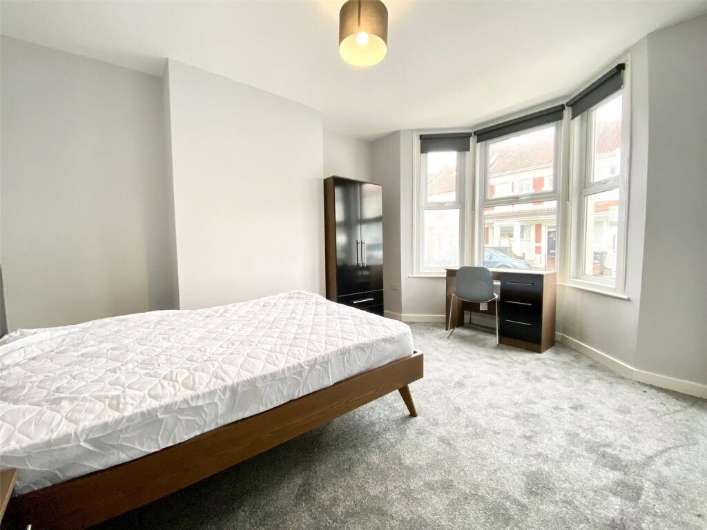 Bright and spacious double bedroom featuring la...
