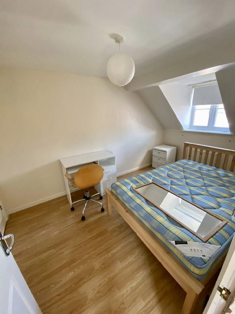 Charming double bedroom featuring a cozy layout...